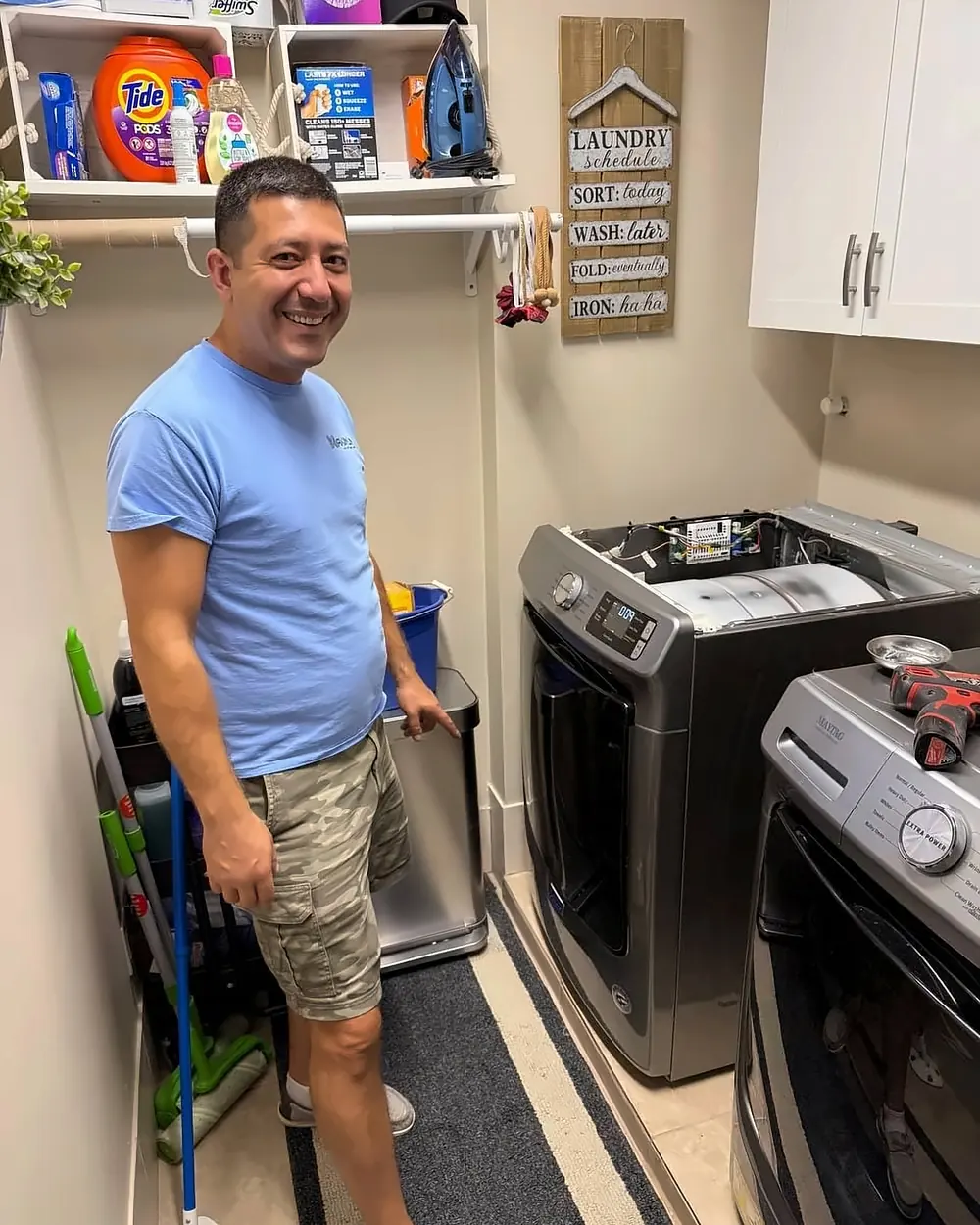 A Maximum technician in a customer's laundry room
