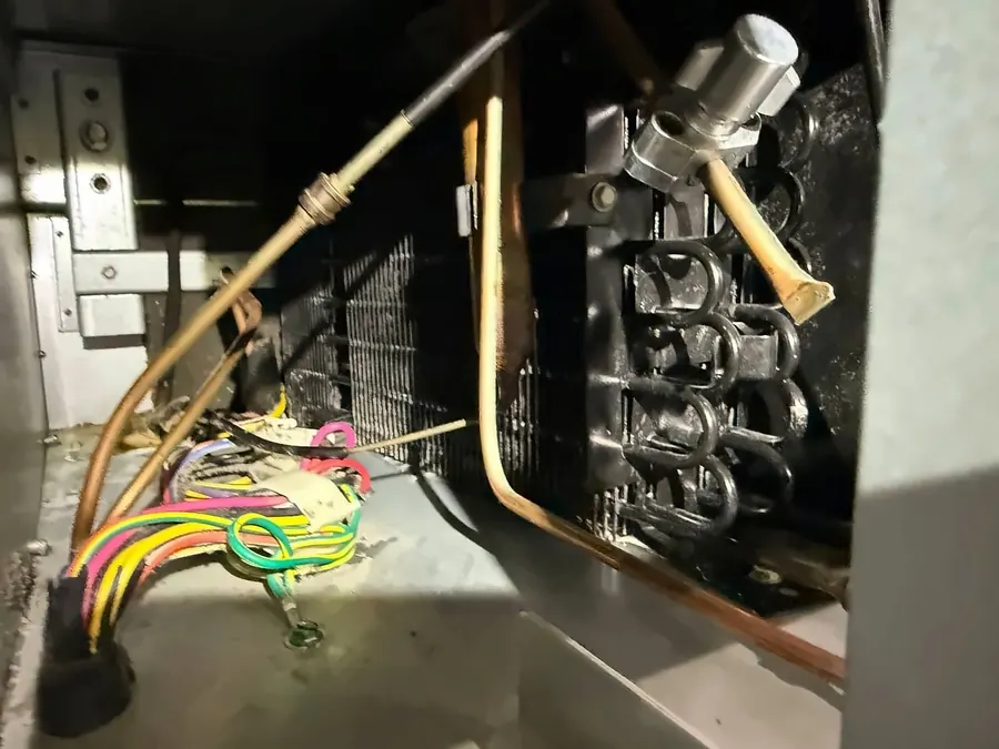 Copper refrigerant lines and wiring inside a refrigeration unit